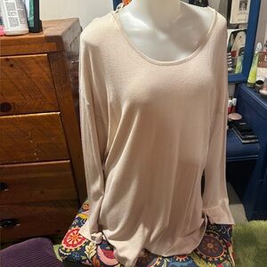 Stunning knit tunic with a zipper detail at back.